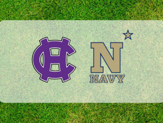 Navy-Holy Cross logos on grass